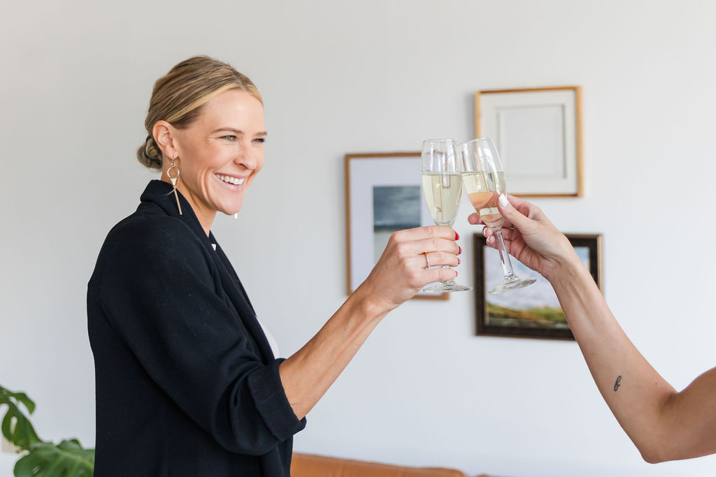 Chelsea Cadwell holding a champagne glass